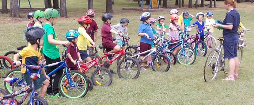 students with bikes and helmets