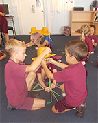 students building with straws